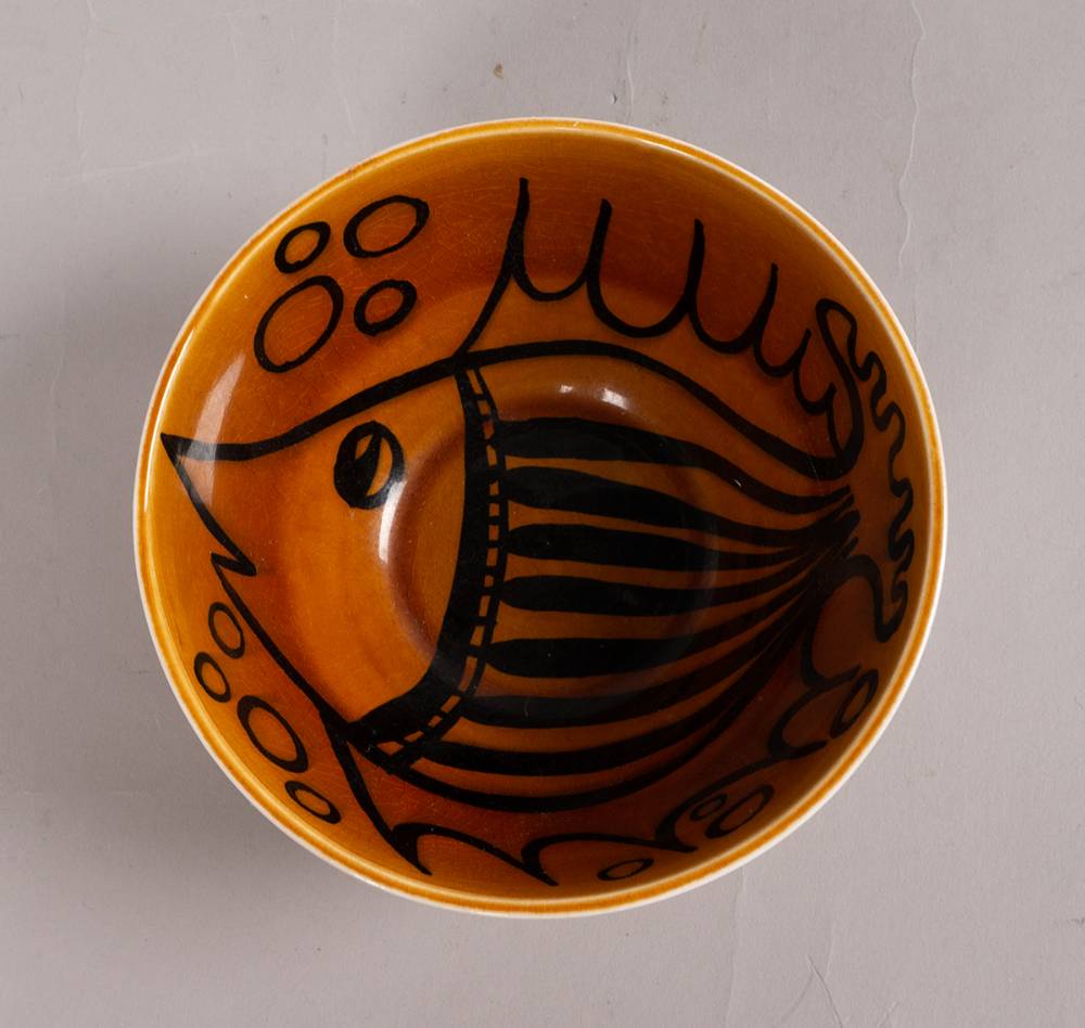 BLACK AND AMBER BOWL WITH FISH DESIGN, 1962-64 by John ffrench sold for 540 at Whyte's Auctions