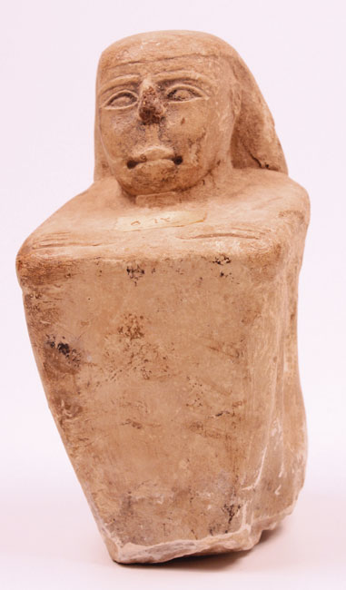 c700-300BC: Late dynastic Egyptian carved seated figure at Whyte's Auctions