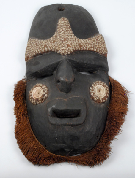 20th Century: Papua New Guinea ceremonial tribal masks and axe at Whyte's Auctions