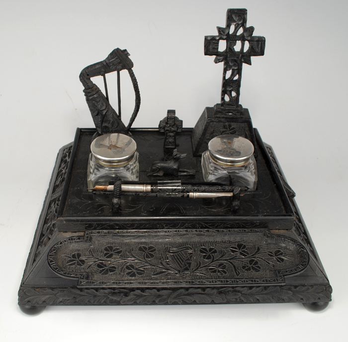 19th Century: Irish Bog Oak writing set with inkwells. at Whyte's Auctions