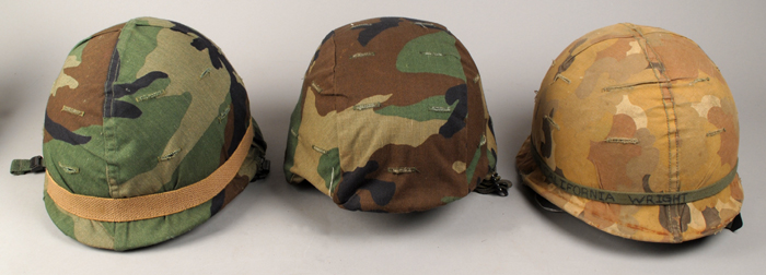 Two Vietnam period U.S. T21 steel helmets and a modern U.S. kevlar helmet. at Whyte's Auctions
