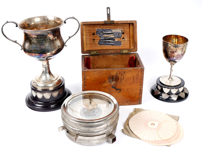 Pigeon Racing trophys and an automatic timing clock. at Whyte's Auctions