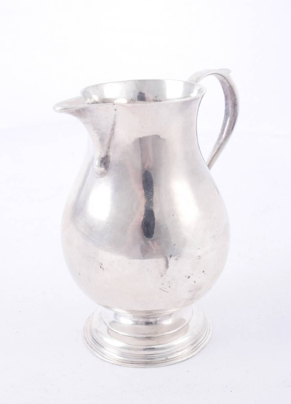 A George I silver sparrow beak cream jug. at Whyte's Auctions