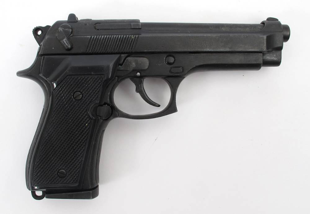 Replica Beretta 9mm pistol and an assault rifle magazine. at Whyte's Auctions