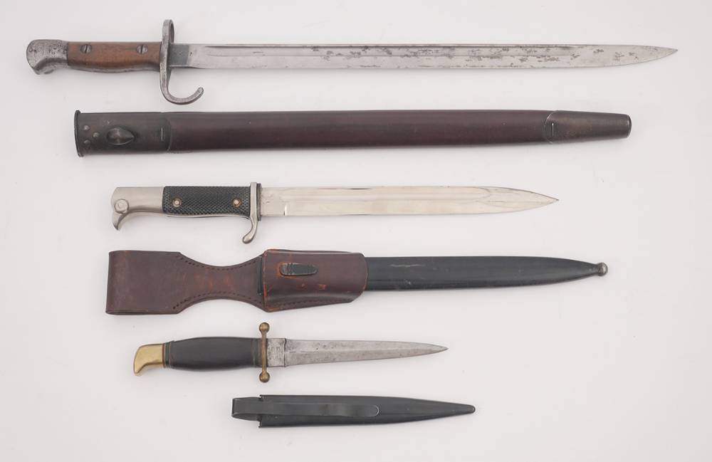 1914 -1945 Edged weapons: Lee Enfield bayonet, German trench knife and a German parade bayonet. at Whyte's Auctions