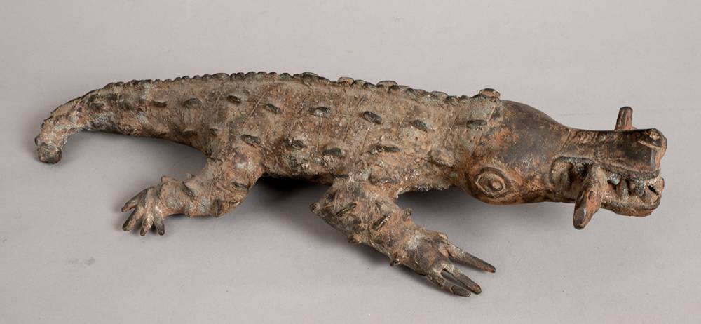 'Benin bronze' crocodile with a fish in its mouth. at Whyte's Auctions