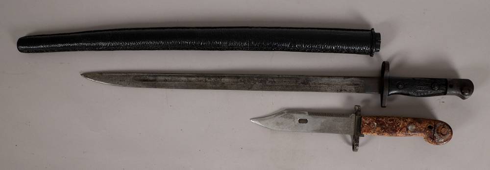 AK47 saw back bayonet and a British World War I 1907 sword bayonet. at Whyte's Auctions