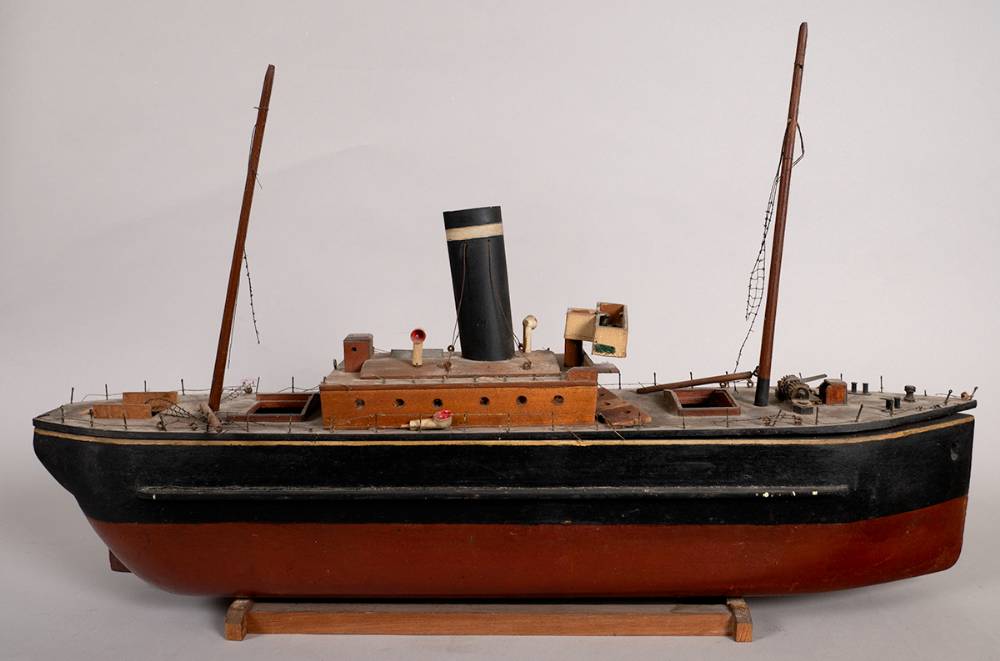 Circa 1920s wooden models of a ship and a double deck bus. at Whyte's Auctions