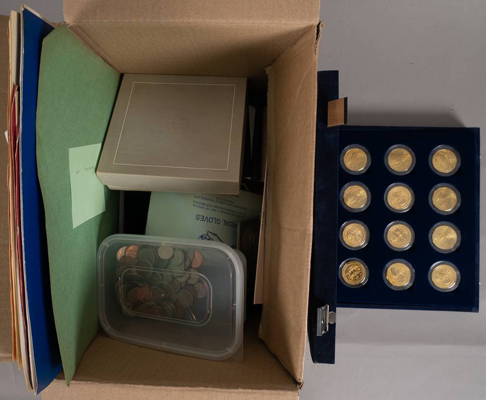 Worldwide collection of mint and proof sets and single coins in presentation folders or cases. (30) at Whyte's Auctions