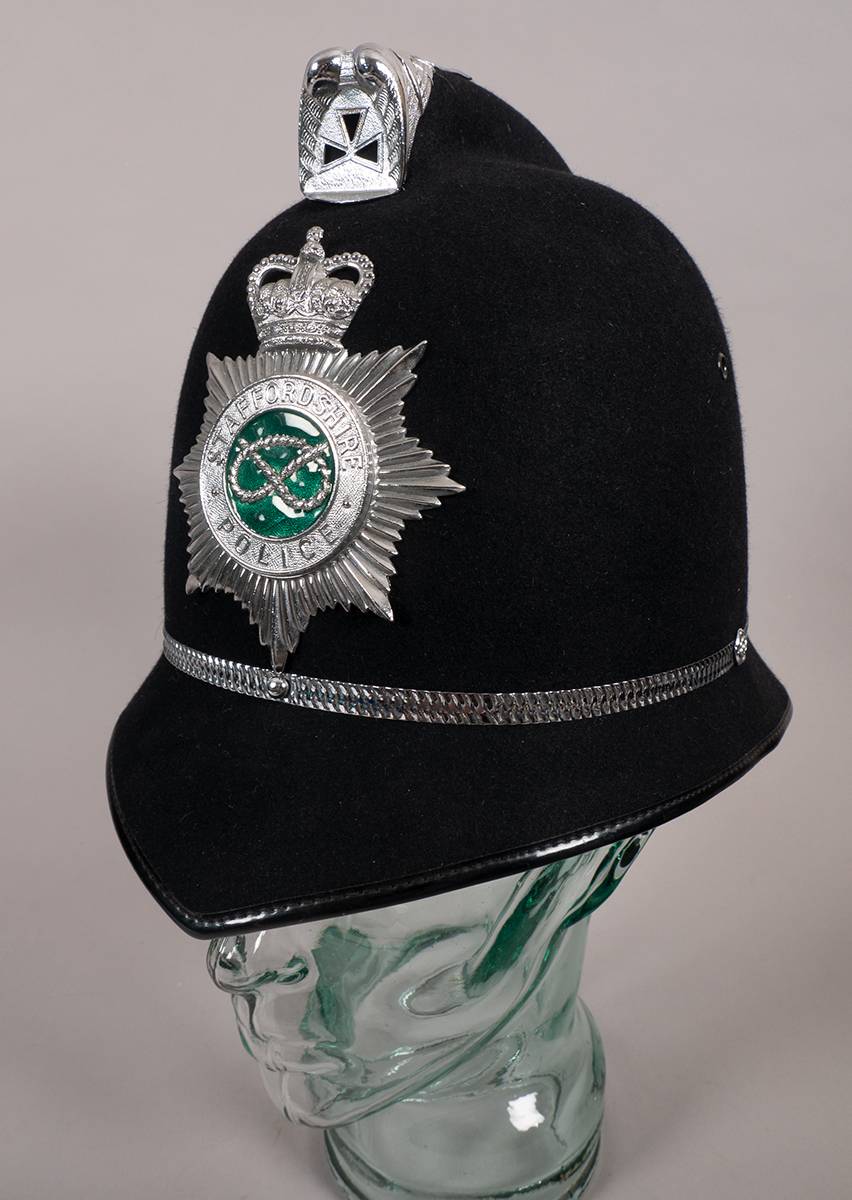 Staffordshire Police black cloth helmet at Whyte's Auctions