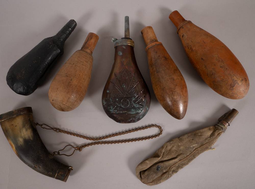 18th/19th century collection of powder flasks. (7) at Whyte's Auctions