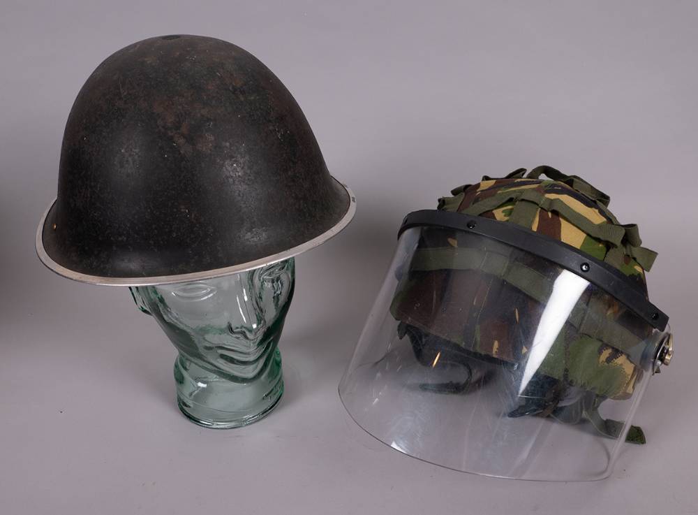 1970s to 1980s Ulster Defence Regiment (UDR) helmets (2) at Whyte's Auctions