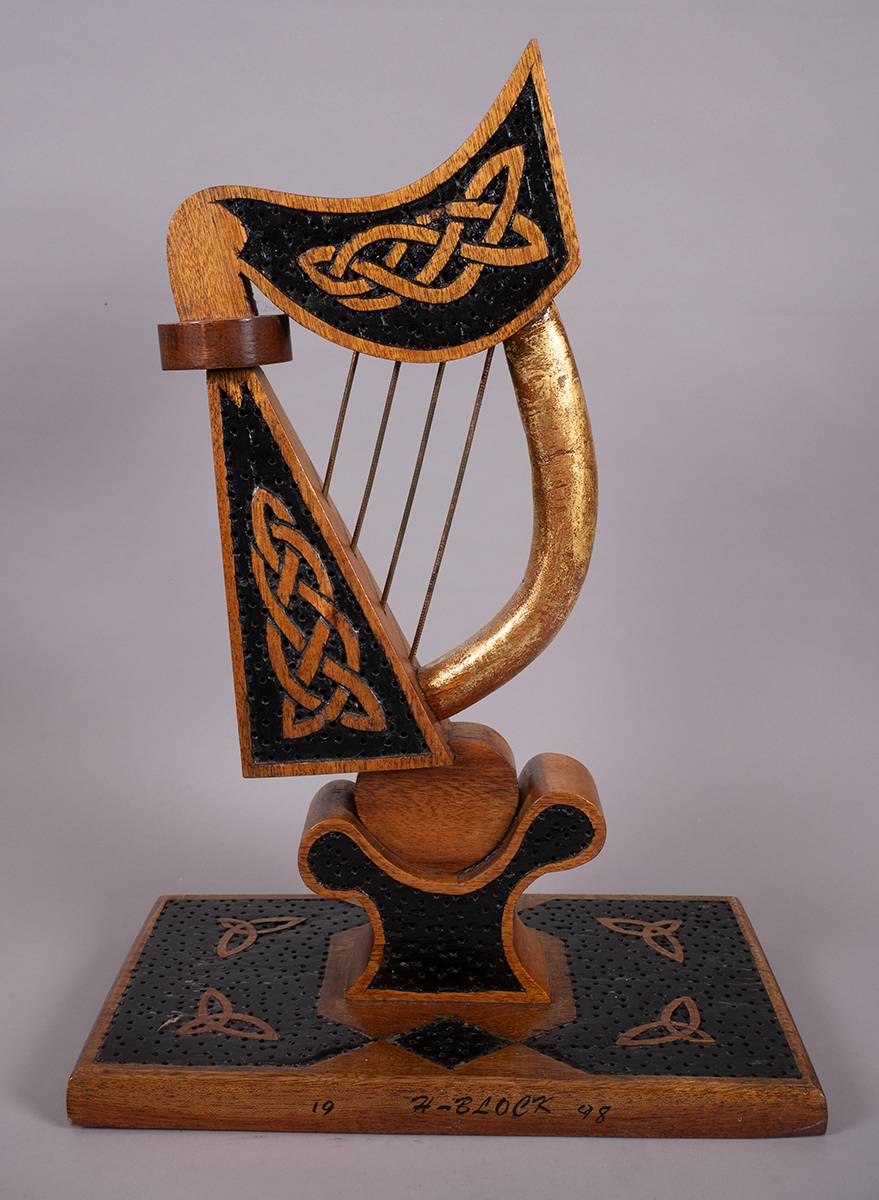 1998. Maze Prison, Long Kesh prisoner art: attractive carved harp with celtic motifs. at Whyte's Auctions